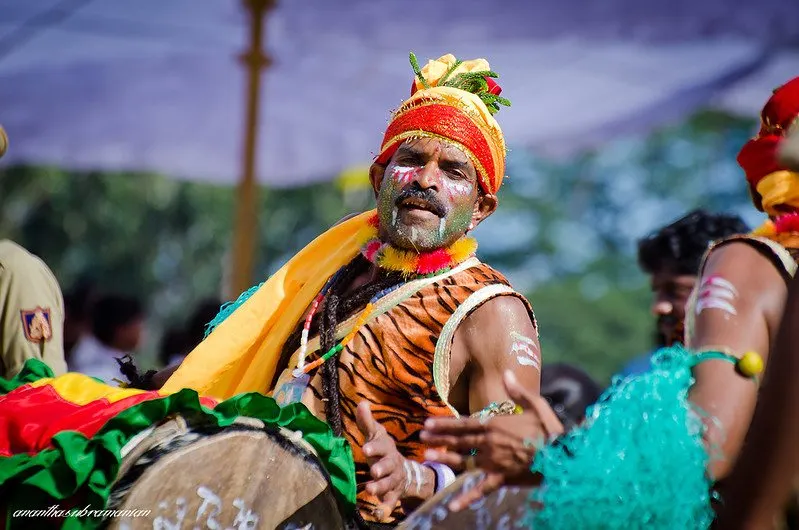 A folk drummer in full colour at a cultural evening